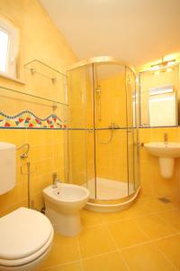 a bathroom with a shower and a toilet and a sink at Holiday house with a parking space Nerezine, Losinj - 8016 in Nerezine