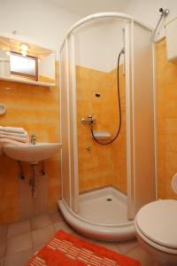 a bathroom with a shower and a sink at Apartments with a parking space Mali Losinj (Losinj) - 7969 in Mali Lošinj