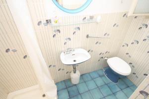 a bathroom with a sink and a toilet at Apartments with WiFi Mali Losinj (Losinj) - 7992 in Mali Lošinj