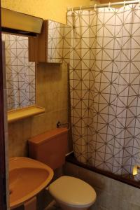 a bathroom with a toilet and a sink at Apartments by the sea Mali Losinj (Losinj) - 8001 in Mali Lošinj
