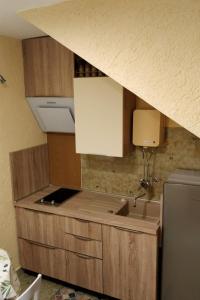 a kitchen with a sink and a counter top at Apartments by the sea Mali Losinj (Losinj) - 8001 in Mali Lošinj