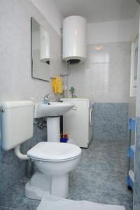 a bathroom with a toilet and a sink at Apartment Opatija 7896a in Opatija