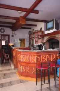 a kitchen with a bar with writing on it at Apartments and rooms by the sea Mali Losinj (Losinj) - 7977 in Mali Lošinj