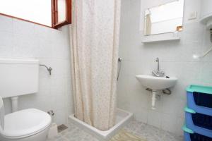 a bathroom with a toilet and a sink at Holiday house with a parking space Sveti Jakov, Losinj - 7950 in Nerezine