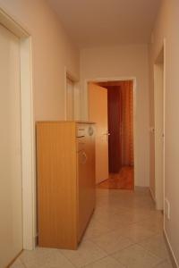 an empty room with a refrigerator and a hallway at Apartments with a parking space Opatija - 7857 in Opatija
