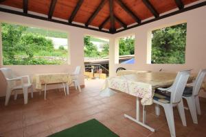 a dining room with a table and chairs at Rooms with a parking space Opatija - 7854 in Opatija