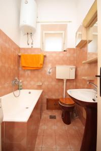a bathroom with a toilet and a sink at Apartments by the sea Cres - 7875 in Cres