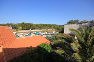 an overhead view of a building with an orange roof at Apartments by the sea Artatore, Losinj - 7934 in Cunski