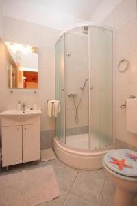 Ένα μπάνιο στο Apartments with WiFi Mali Losinj (Losinj) - 7943 +27 φωτογραφίες