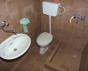a bathroom with a toilet and a sink at Apartments by the sea Postira, Brac - 9241 in Postira