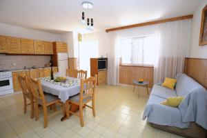 a kitchen and living room with a table and a couch at Apartment Prizba 9255b in Prizba