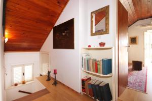 a room with a book shelf with books at Seaside holiday house Brna, Korcula - 9235 in Smokvica