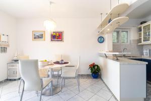 A kitchen or kitchenette at Apartments by the sea Cove Gradina, Korcula - 9273