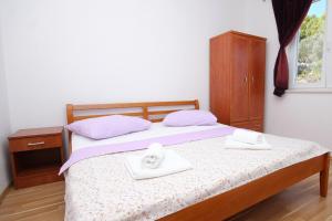 Postel nebo postele na pokoji v ubytování Apartments with a parking space Lumbarda, Korcula - 9271