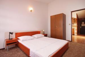 Postel nebo postele na pokoji v ubytování Apartment Prizba 9227c