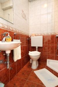 a bathroom with a toilet and a sink at Apartments by the sea Lumbarda, Korcula - 9300 in Lumbarda +22 photos