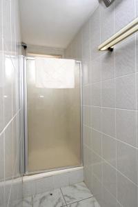 a shower with a glass door in a bathroom at Apartments with a parking space Racisce, Korcula - 9170 in Račišće