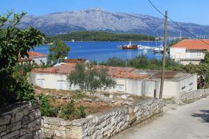 a view of a body of water with mountains in the background at Apartments by the sea Lumbarda, Korcula - 9263 in Lumbarda +10 photos