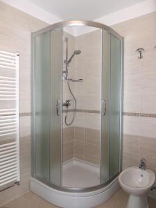a shower with a glass door in a bathroom at Apartments with parking space Cres - 7876 in Cres +31 photos