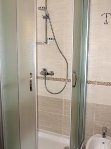 a shower in a bathroom with a toilet and a sink at Apartments with a parking space Cres - 7876 in Cres