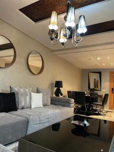 a living room with a couch and a table at Luxury apartment in downtown of kenitra in Kenitra