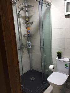 a shower in a bathroom with a toilet at Luxury apartment in downtown of kenitra in Kenitra