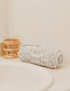 a towel sitting on a counter next to a basket at Puamana Maluhia - Two Bedroom / Two Bath Condo in Princeville