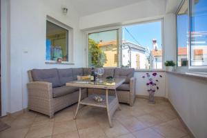 a living room with a couch and a table at Holiday house with a swimming pool Zagore, Opatija - 7922 in Zagorje
