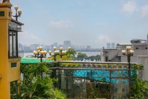 a view of a city from a building with street lights at Babylon Grand Hotel & Spa in Hanoi