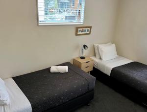 Postel nebo postele na pokoji v ubytování Anchor Lodge Motel