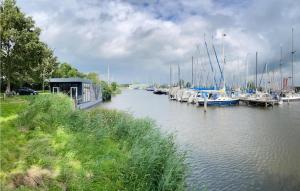 a group of boats are docked in a marina at Awesome Ship In Warns With Kitchen in Warns +15 photos