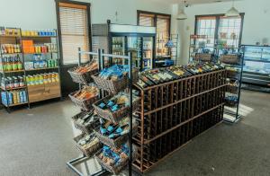 a store aisle with baskets of food on display at Stroll to Slopes, Village Area, Ski in-out MtLodge 269 in Snowshoe