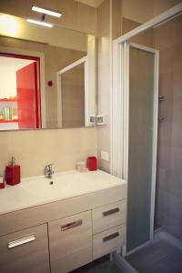 a bathroom with a sink and a mirror at Residenza Alla Piazzetta in Verona