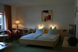 Ένα ή περισσότερα κρεβάτια σε δωμάτιο στο Altes Zollhaus