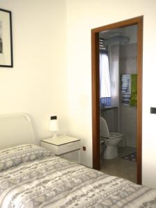 Postel nebo postele na pokoji v ubytování Top Suit Uno - Guest house