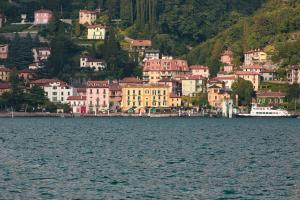 a group of houses on a hill next to the water at Villa Torretta in Varenna