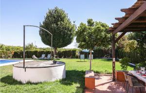 A garden outside Cozy Home In Utrera With Swimming Pool