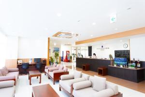 a waiting room with couches and a salon at Hotel Peace Island Miyakojima Shiyakusho Tori in Miyako-jima
