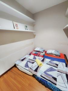 Postel nebo postele na pokoji v ubytování Cozy Suite @ I-City