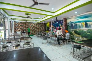 A restaurant or other place to eat at Blizz Hotels- Trishul Express