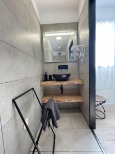 a bathroom with a sink and a mirror at Casa Azzura in Bastia