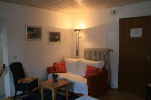a hotel room with a bed with red pillows at Altes Zollhaus in Bad Tölz