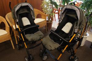 two strollers sitting next to a table and chairs at Hotel Abest Naha Kokusai Street in Naha