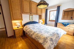 Postel nebo postele na pokoji v ubytování Casa Pergher