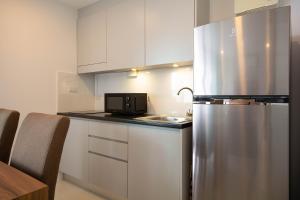 Kuchyň nebo kuchyňský kout v ubytování Mantra Beach condominium M257