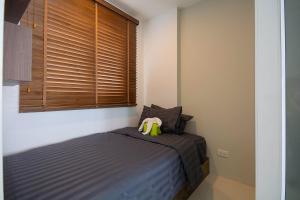 Postel nebo postele na pokoji v ubytování Mantra Beach condominium M257 + 35 fotografií