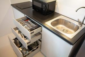 Kuchyň nebo kuchyňský kout v ubytování Mantra Beach condominium M257