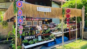 a garden stand with a bunch of plants on display at Sean Sabai Home e Ristobar in Taling Ngam Beach