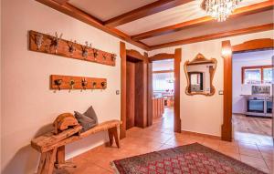 a living room with a wooden bench in a room at Beautiful Home In St, Gallenkirch With 6 Bedrooms, Sauna And Wifi in Aussersiggam