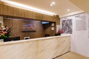 a lobby of a hotel with a reception desk at Lucky House Khaosan in Bangkok